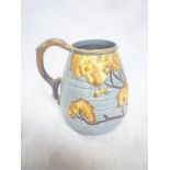 A Carltonware pottery tapered jug with raised leaf and branch decoration and rustic handle