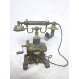 An early pre-First War type 16 telephone with hand cranked handle and iron base with bells