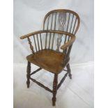 A 19th Century elm Windsor style armchair with pierced splat and spindle back,