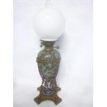 A Victorian Doulton Lambeth pottery oil lamp dated 1882 with brass scroll mounts,