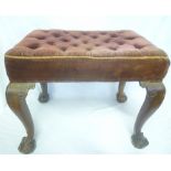 A 19th Century mahogany rectangular stool upholstered in buttoned velvet on cabriole legs with claw