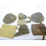 Two Second War British steel helmets, one minus liner; a 1943 Officer's map case,