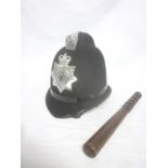 A Northumbria Police helmet together with wooden truncheon