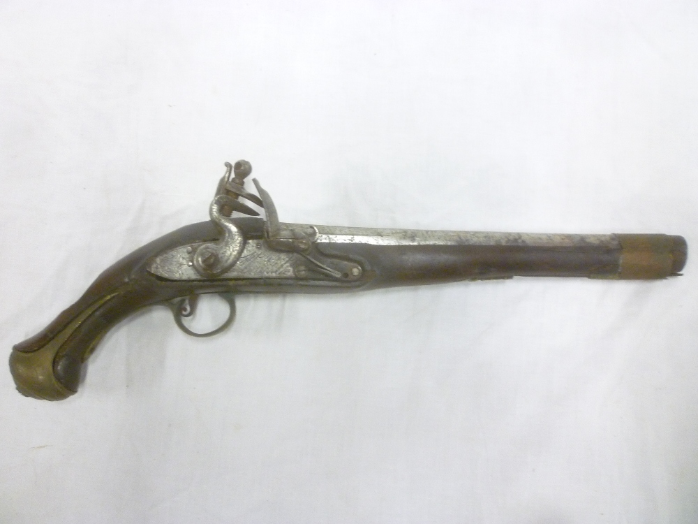 An 18th Century French flintlock holster pistol with 11" steel barrel, engraved steel lock,