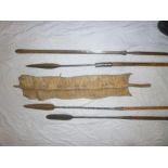 Four various African spears including Masaii lion spear etc and a rectangular hide-mounted shield