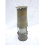 An old brass miner's lamp by W E Teale & Co Swinton Lancashire