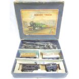 Hornby O gauge - boxed clockwork train set comprising black 0-4-0 locomotive and tender,