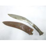 A Gurkha kukri with curved single-edged blade,