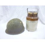 A Second War US steel combat helmet and a stoneware anti gas ointment jar (2)