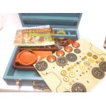 A wooden box containing a selection of 1940's/50's red/green Meccano including number 9 outfit