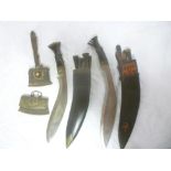 Two Gurkha kukris with curved single edged blades and horn hilts in leather sheaths with utility