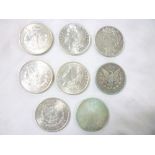 A selection of American silver dollars including 1883, 1886, 1889, 1897, 1900,
