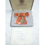 A ladies MBE with ribbon,