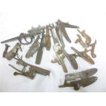 A selection of various gun parts including percussion gun locks and hammers, shotgun lock plates,