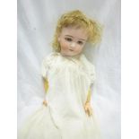 A German porcelain headed "Jutta" doll by Simon & Halbig with painted face, sleeping eyes,