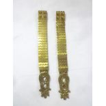 A pair of 19th Century brass scaled straps from a heavy Cavalry cuirass with leaf decorated scroll