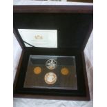 A 2013 guinea anniversary silver proof set comprising two silver proof crowns and gilt guinea