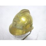 A French brass fire helmet with helmet plate "Sapeurs Pompiers de Loueches"