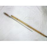 An old sword stick with square tapered blade in rustic walking cane mounts