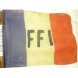 An original Second War French FFI flag displayed in the street at the end of the war,