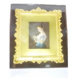 An ornate gilt rectangular picture frame decorated in relief with leaves and flowers,