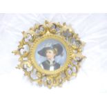 A 19th Century Continental porcelain dish plaque depicting a bust portrait of a female within an