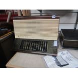 A wooden cased Pye PE60 radio with paperwork