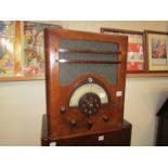 An Ultra Electric Ltd walnut cased Ultra 'Teledial' 400 radio with Magic-Eye tuning indicator,