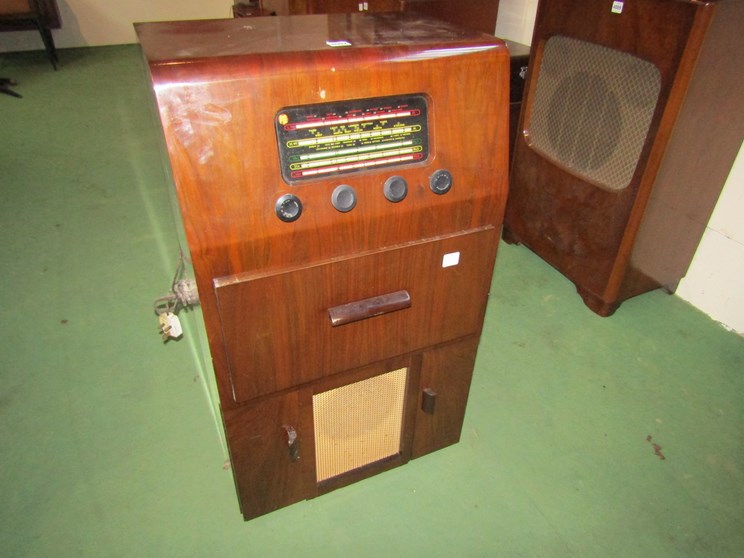 A wooden cased Pye radiogram with central drawer housing turntable