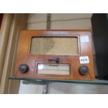 A vintage McCarthy walnut cased radio