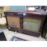 A Philips type 681A/15 wooden cased radio with Bakelite knobs