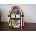 A novelty radio/cassette player in the form of a jukebox
