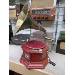 A reproduction HMV gramaphone with brass horn
