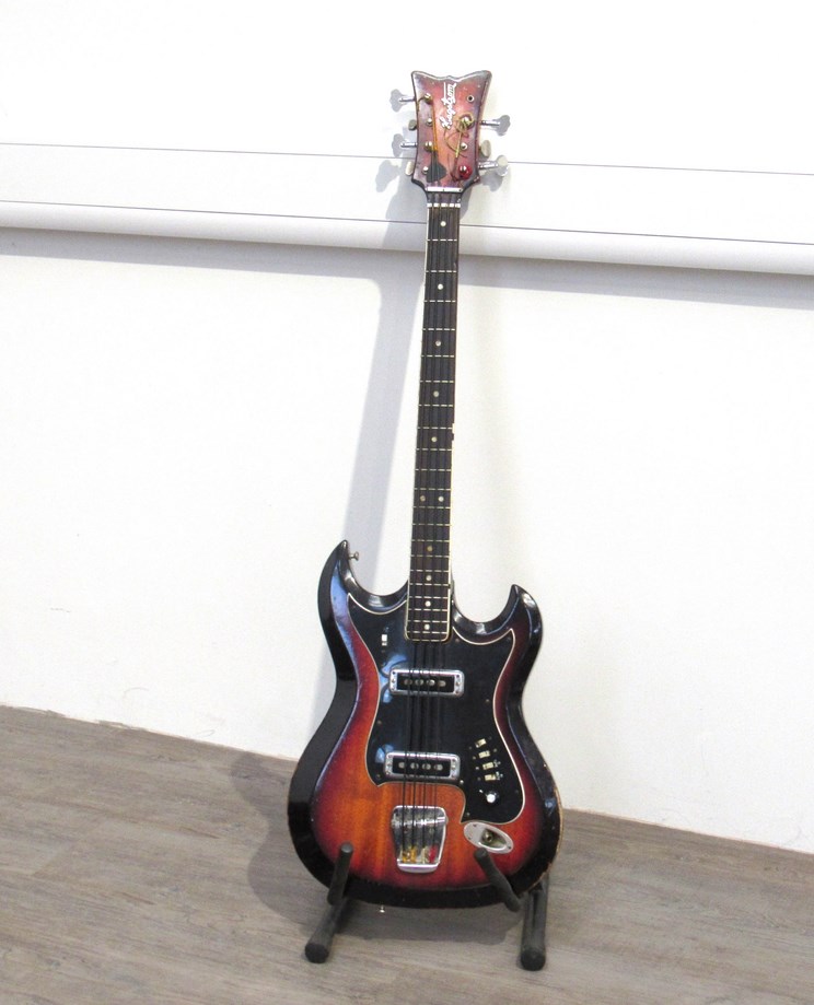 A late 1960's Hagstrom H8 8 string electric bass guitar, twin shoulder body with sunburst paintwork,