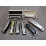 Eight various Hohner harmonicas including Marine Band Deluxe Ab