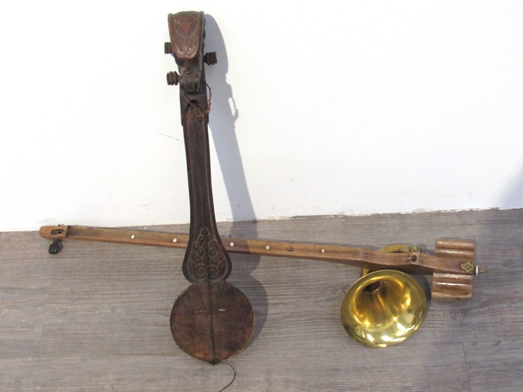 A vintage phonofiddle together with an Ethnic carved stringed instrument (2)