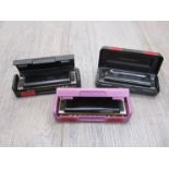 Three various Hohner harmonicas including Pro Harp D,