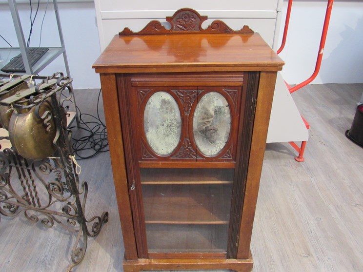 A late Victorian walnut music cabinet,