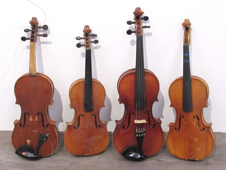 Four mixed student-grade violins including Skylark,