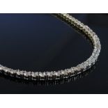 A graduated diamond necklace set with 172 stones, 46cm long, 22.