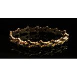 An 18ct gold fancy link bracelet, 19cm long,