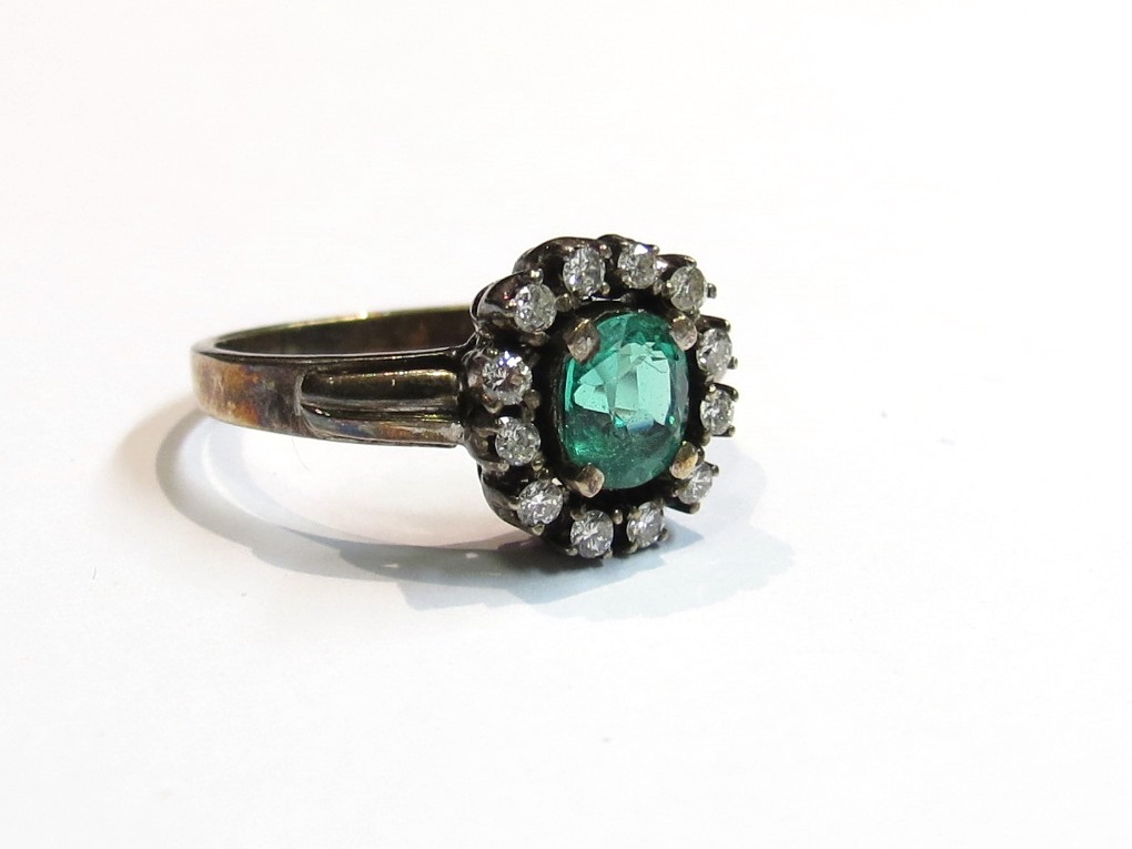 An emerald and diamond ring, unmarked, size O,