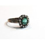 An emerald and diamond ring, unmarked, size O,