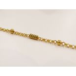 A gold bracelet with ball and barrel links, stamped 916, 17.5cm long, 6.