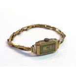 A gold cased lady's wristwatch, 12.