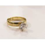 A gold ring set with single clear stone, stamped 14k, size N,