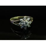 A gold diamond daisy ring, marks rubbed, size K, 2.