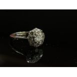 WITHDRAWN -An 18ct gold platinum set diamond daisy ring, central stone 0.25ct approx., size K/L, 2.