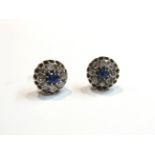 A pair of diamond and sapphire earrings,