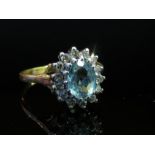 An 18ct gold aquamarine and diamond cluster ring, size N, 3.